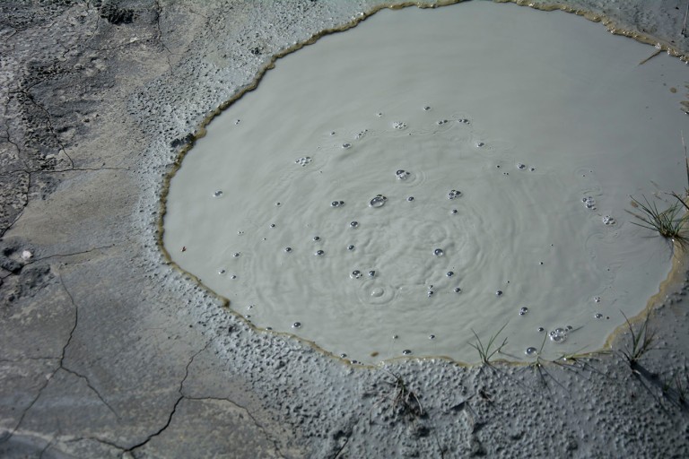 Methane release creates bubbles in the mud of the volcano.